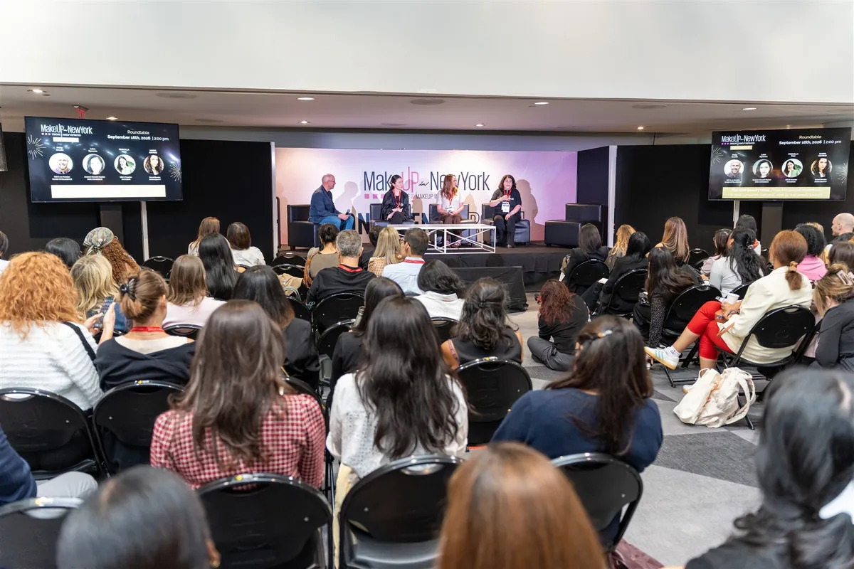 Luba Ilyasova speaking on a MakeUp in NewYork panel in front of an audience.